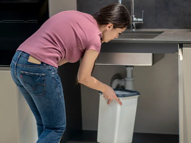 Putting a trash can under the kitchen sink