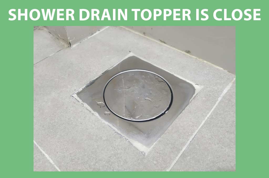 The shower drain topper is closed